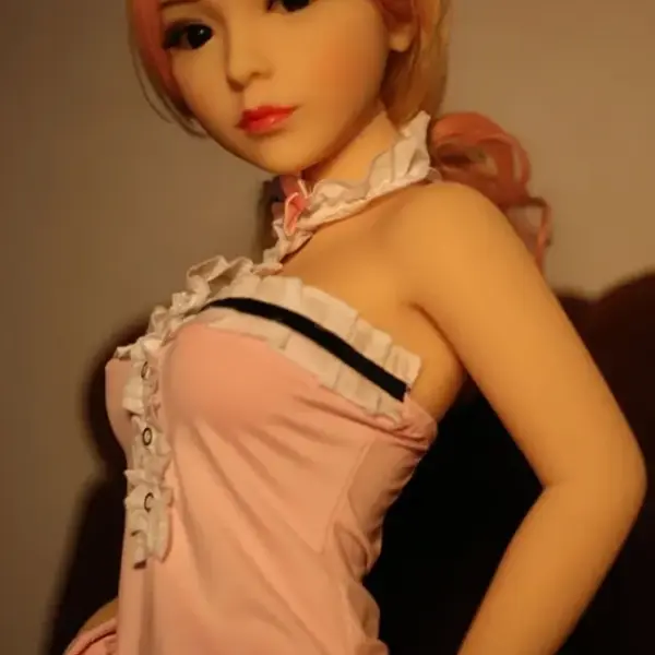 TPE petite love doll showing lifelike standing pose with flexible joints